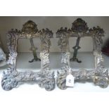 A pair of late Victorian gilded iron photograph frames,