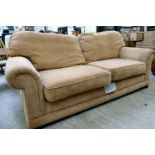 A modern three person settee with a level back and scrolled arms,