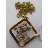 A 9ct gold framed emerald and diamond set pendant,