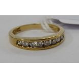 A 9ct gold diamond set half-eternity ring 11