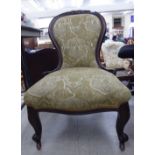 A late Victorian lady's mahogany showwood framed spoonback chair,