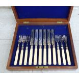 A set of six Edwardian engraved silver plated fruit knives and forks,