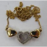 A 9ct gold conjoined, triple heart and diamond set necklet,