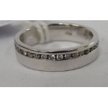 An 18ct gold diamond set wedding ring 11