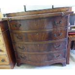 An early 20thC reproduction of a George III mahogany bow front dressing chest,