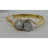 An 'antique' 18ct gold two stone diamond crossover ring 11