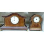 Two similar Edwardian ebony and string inlaid mahogany cased mantel clock;