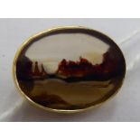 An oval yellow metal framed agate 'picture' brooch 11