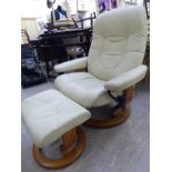 A modern cream coloured fabric upholstered recliner chair,