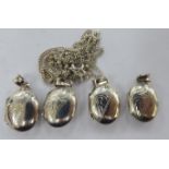 Four silver oval lockets and one fine neckchain 11