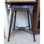 A late Victorian mahogany hall table, the top with a thumb moulded edge, raised on ring turned,