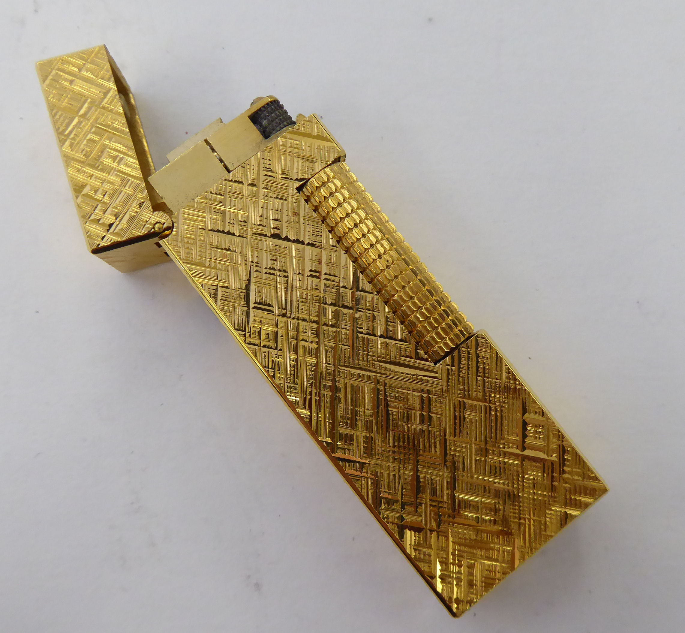 A Dunhill textured yellow metal plated box cased,