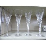 Two pairs of Waterford crystal wine flutes, two 'I Love Lismore' pattern heart shaped ornament,