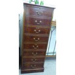 A modern figures walnut finished four drawer filing cabinet,