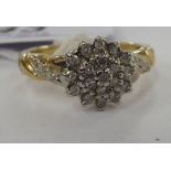 A 9ct gold claw set diamond cluster ring 11