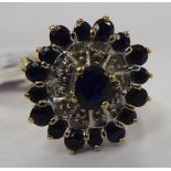 A 9ct gold diamond and sapphire set cluster ring 11