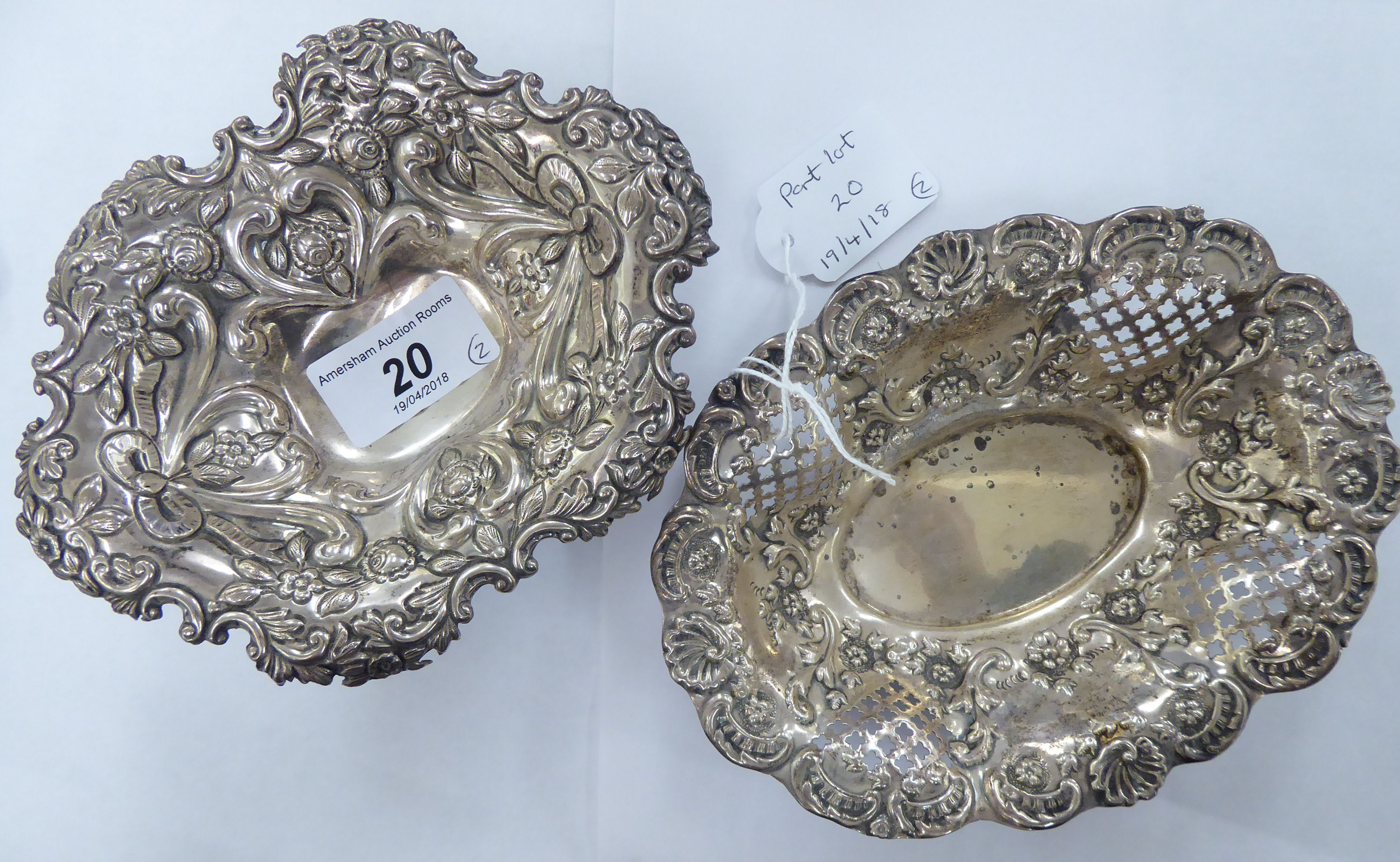 Two similar oval silver sweet dishes with pressed decoration mixed marks 5.