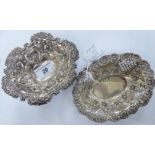 Two similar oval silver sweet dishes with pressed decoration mixed marks 5.