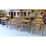 A set of four mid 20thC light stained beech framed chapel chairs with solid seats,