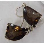 A pair of silver and claw set citrine pendant earrings 11