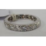 A white gold coloured metal diamond set eternity ring 11