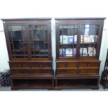 A pair of late 19thC mahogany library cabinet bookcases, each with a straight cornice,