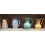 Four dissimilar 1930s pottery jugs/vases, variously decorated in sponged colours,