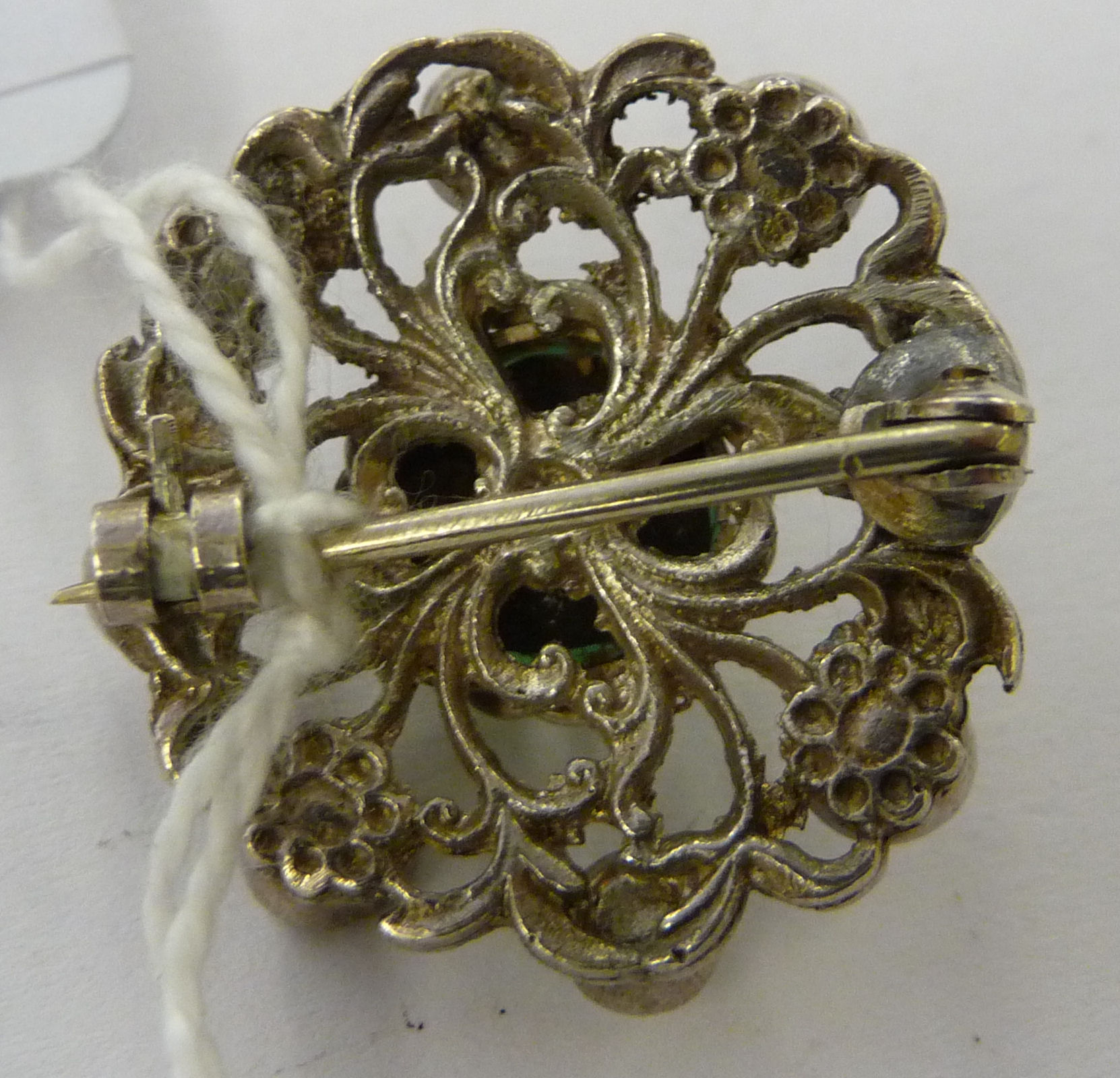 A white metal brooch, set with a green stone, - Image 2 of 2