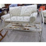 A Victorian style white painted steel wire framed garden seat with a slatted base and open arms