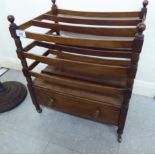 A mid 20thC Victorian style, mahogany framed, three division Canterbury with a single drawer,