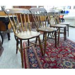 A set of four early/mid 20thC beech and elm framed dining chairs,