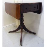 A Regency rosewood pedestal Pembroke table, the top with a crossbanded border and round corners,