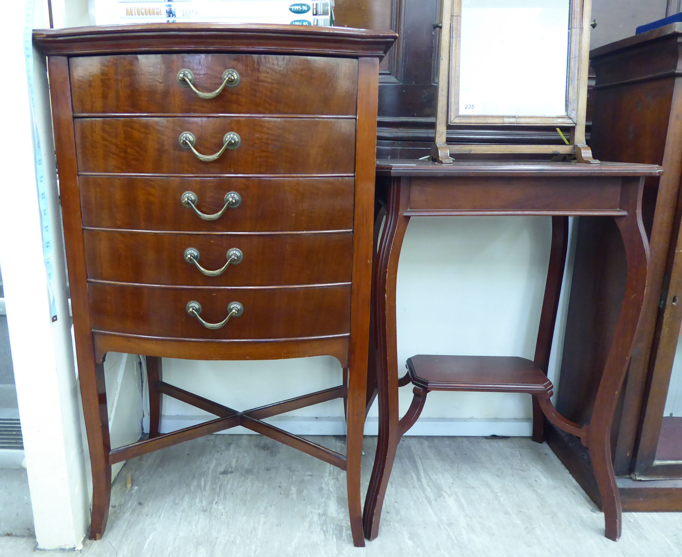 An Edwardian mahogany bow front sheet music cabinet with five drawers,