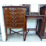 An Edwardian mahogany bow front sheet music cabinet with five drawers,