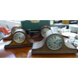 Four similar 1930/40s laminated cased, Napoleans' hat style mantel clocks,