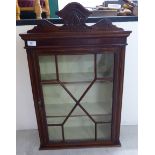 A late 19thC satinwood string inlaid mahogany hanging display cabinet with a carved upstand cornice,