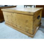 An early 20thC honey coloured pine chest with straight sides,