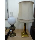 A mid 20thC brass table lamp with on hexagonal column,