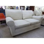 A modern two seater settee, upholstered in textured two tone cream coloured fabric,