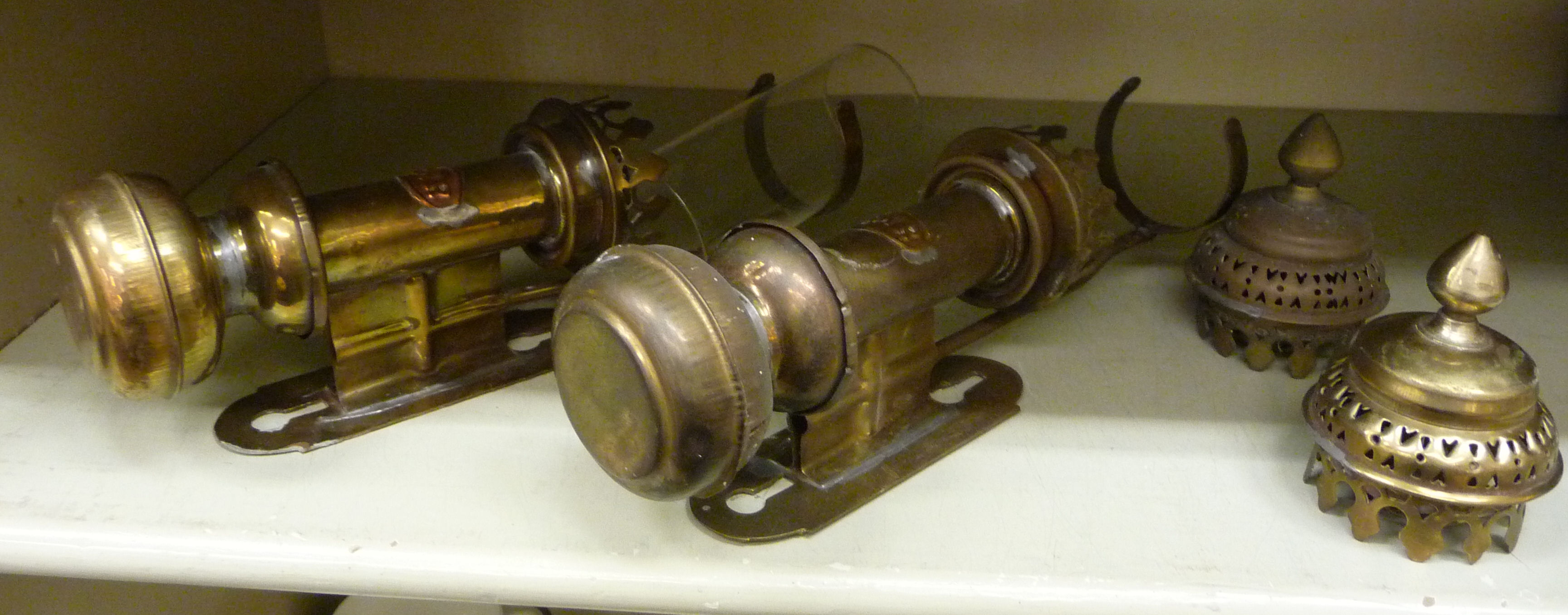 A pair of lacquered brass wall mounted railway carriage lamps,