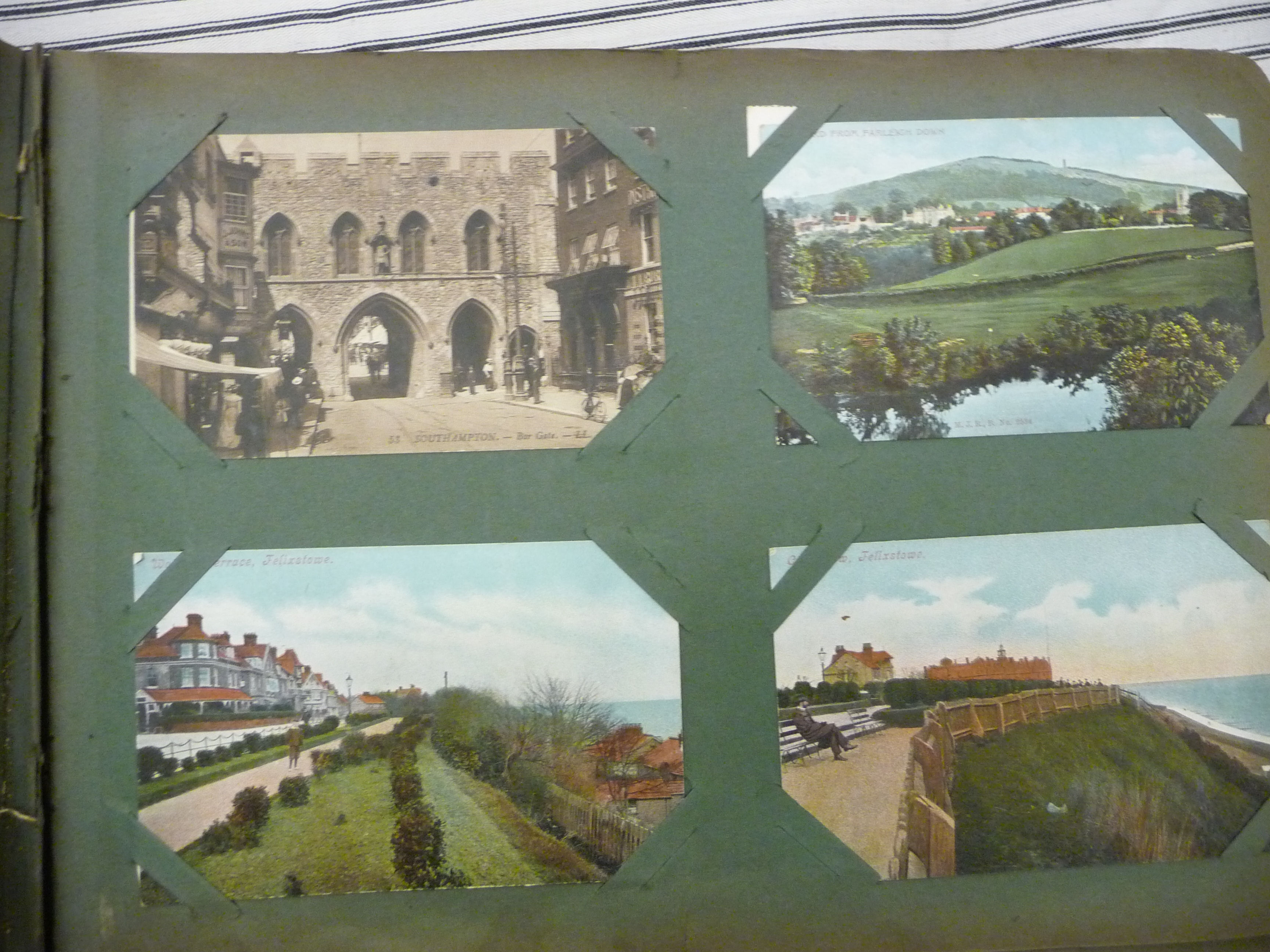 An uncollated early 20thC postcard album, containing seaside, - Image 2 of 5