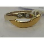 A 9ct bi-coloured gold crossover ring,