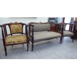 An Edwardian satinwood string inlaid mahogany showwood framed salon suite,