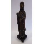 An Oriental cast bronze figure, a standing, robed woman,