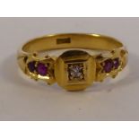 An 18ct gold ring, set with a diamond,