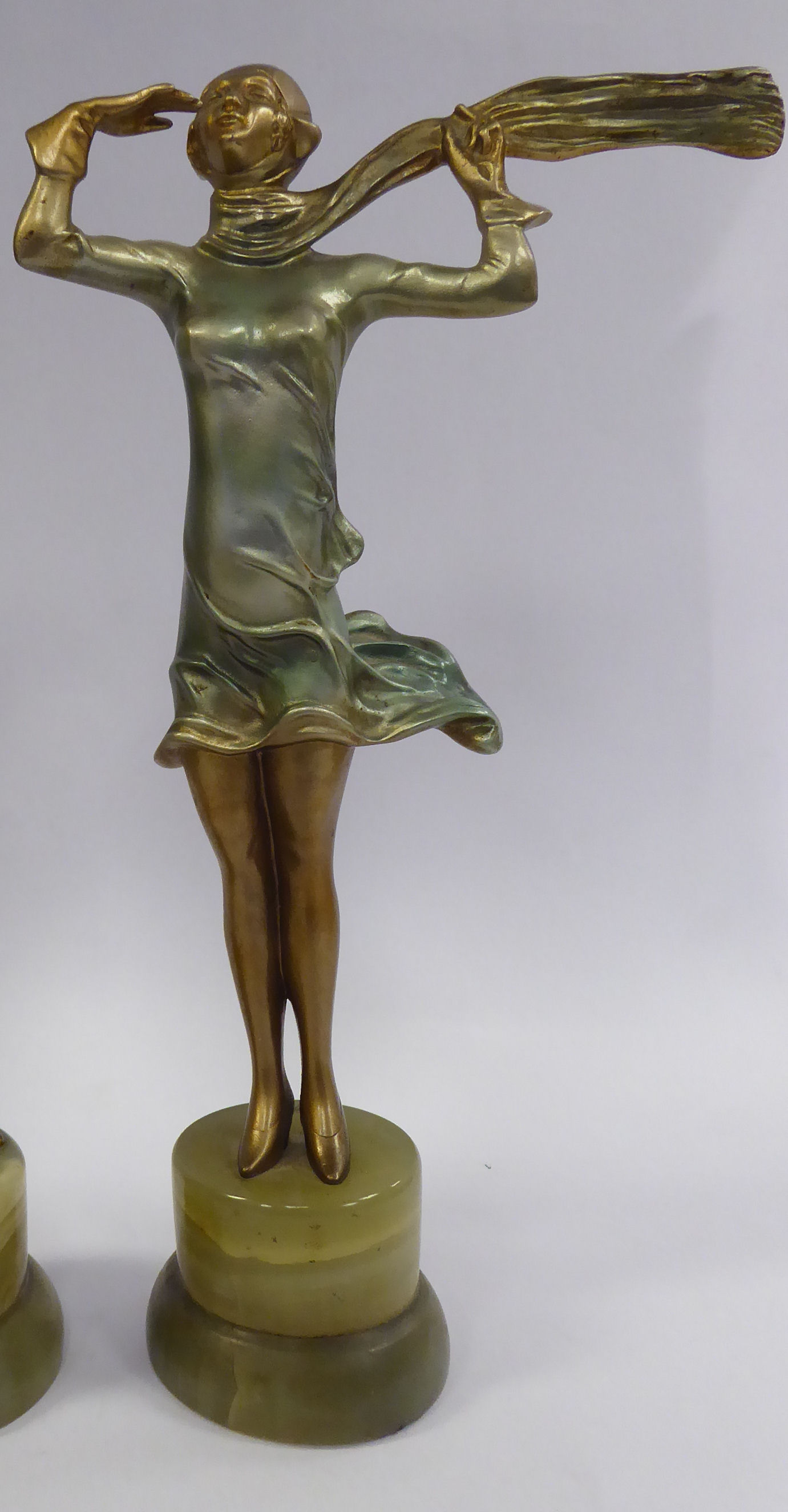 A late 1920s/early 1930s painted cold cast figure, a fashionable young woman,