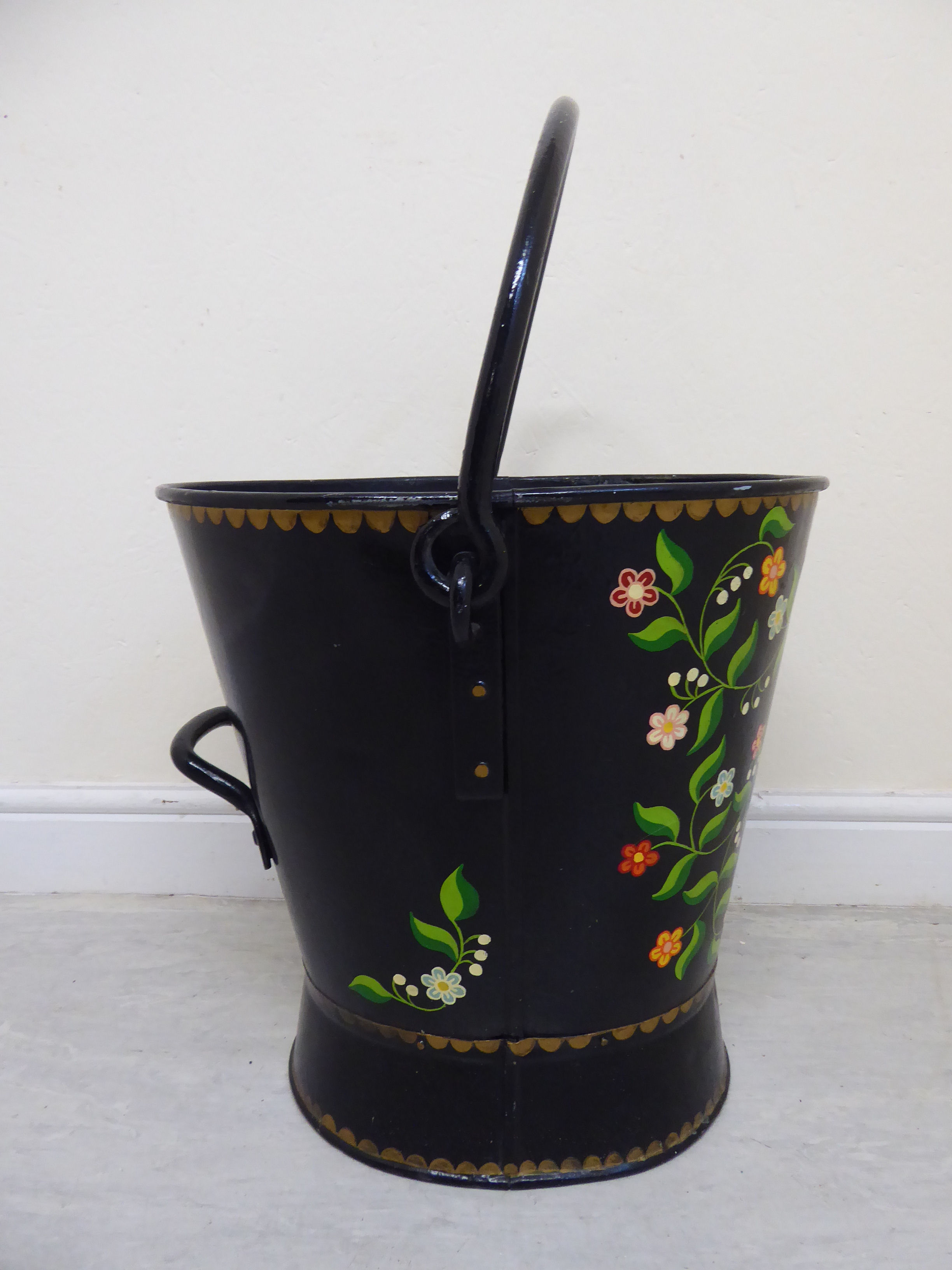 A late 19th/early 20thC Toleware bucket of tapered and waisted oval form with a rivetted fixed and - Image 4 of 6