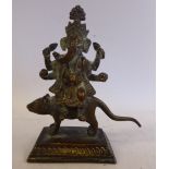 A cast bronze figure of Ganesha, seated on a stylised animal,