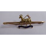 A gold coloured metal and coloured enamel bar brooch,