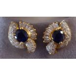 A pair of 18ct gold claw set sapphire and diamond earrings